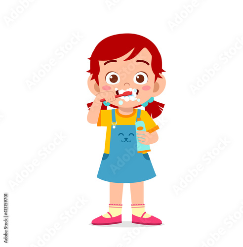 cute little girl brushing teeth and holding toothpaste