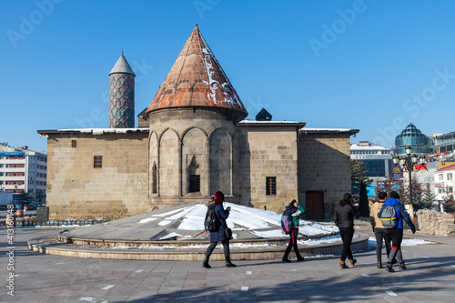 View over Yakutiye Madrassah which was an ancient islamic theology school, with a pool in the park, in Erzurum, Turkey. photo