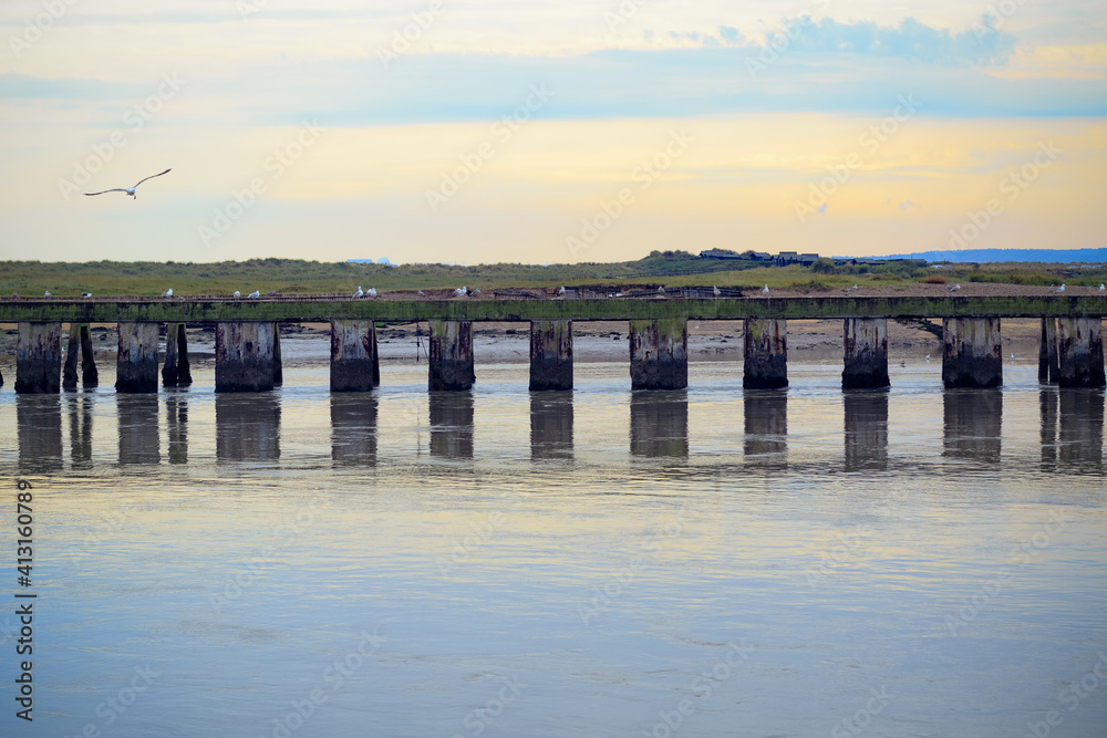 Sunset at the junction of River Blyth and Dunwich River in Southwold, a popular seaside town of the UK Sunset at the junction of River Blyth and Dunwich River in Southwold, a popular seaside town of the UK