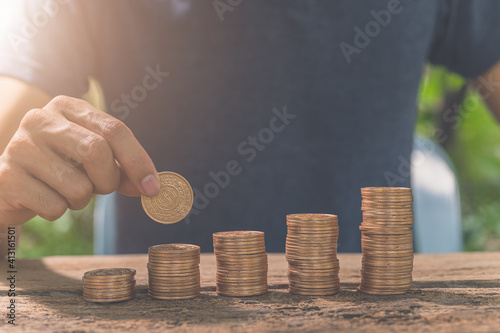 Canvastavla Man collating coins. The concept of financial growth.