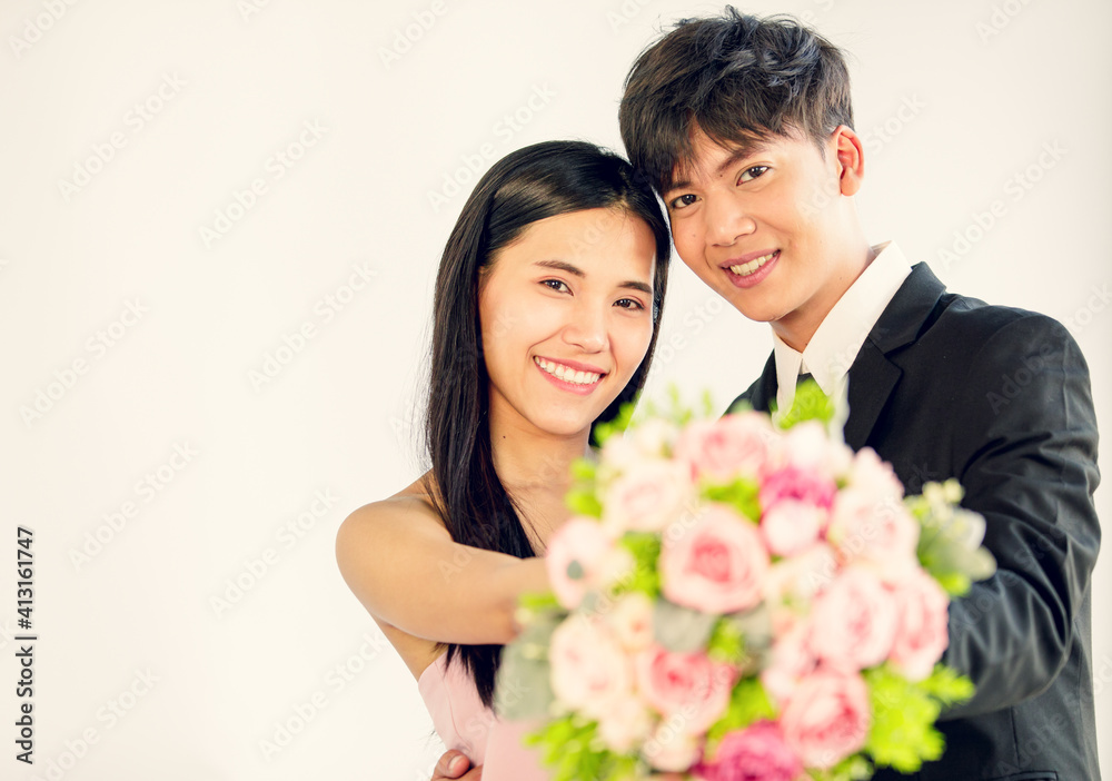 Man and woman lover holding bouquet and smile with happy Man and woman lover holding bouquet and smile with happy