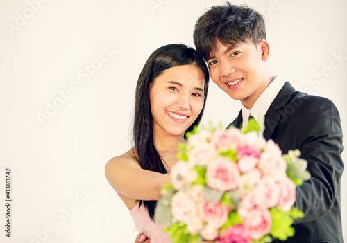 Man and woman lover holding bouquet and smile with happy