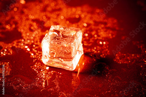 Red ice ball reflection on black background. photo