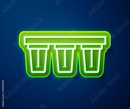 Glowing neon line Water filter icon isolated on blue background. System for filtration of water. Reverse osmosis system. Vector.