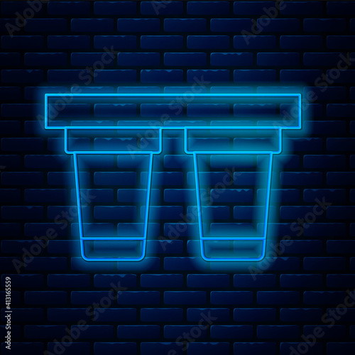 Glowing neon line Water filter icon isolated on brick wall background. System for filtration of water. Reverse osmosis system. Vector.