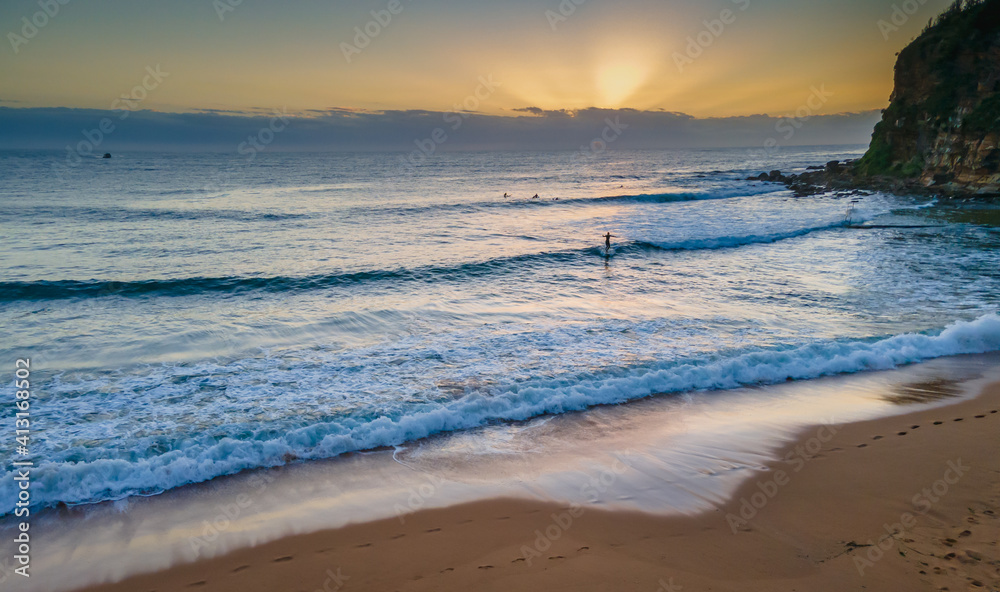 Aerial sunrise seascape with low cloud bank