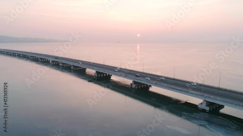 Wallpaper Mural Aerial drone view of low-water bridge across the bay with moving car during the sunset. Active movement of transport cars vehicles in different directions. Torontodigital.ca