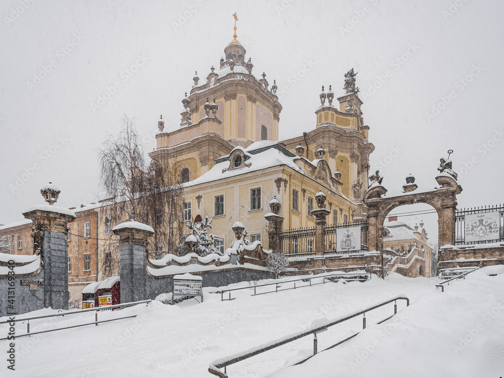 LVIV, UKRAINE - FEBRUARY 10, 2021: Metropolitan Andriy Sheptytsky monument, St. George's Cathedral, Heavy blizzard, snowstorm.