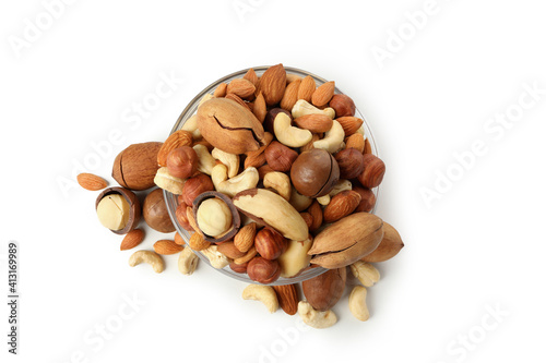 Glass bowl with different nuts isolated on white background