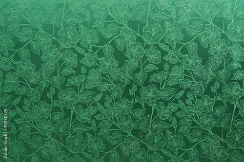 green fabric with a pattern of flowers. drapery, interior detail.