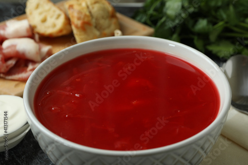 Concept of tasty eating with bowl of tasty borscht