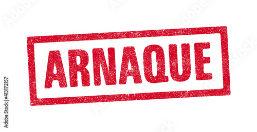 Le mot Arnaque en tampon encreur rouge