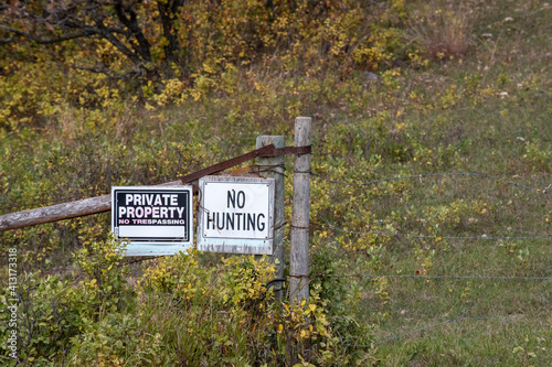 Private Property, No Trespassing, and No Hunting Signs