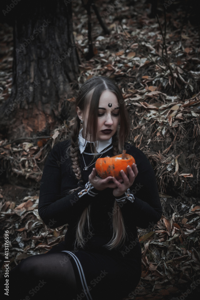 Naklejka premium Witch in the form of a student in the forest