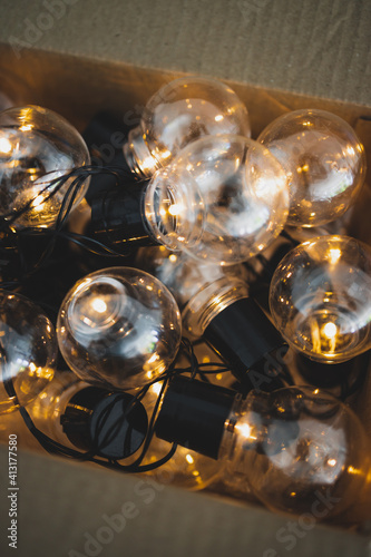 group of light bulbs shining from an open box, mindset and thinking outside the box © faithie