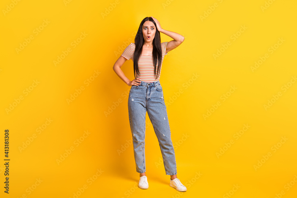 Full length body size photo of female student stressed depressed forgot lost opened mouth isolated on bright yellow color background Full length body size photo of female student stressed depressed forgot lost opened mouth isolated on bright yellow color background