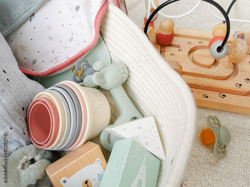 Gender neutral baby shower gift set for a newborn baby in soft colors.