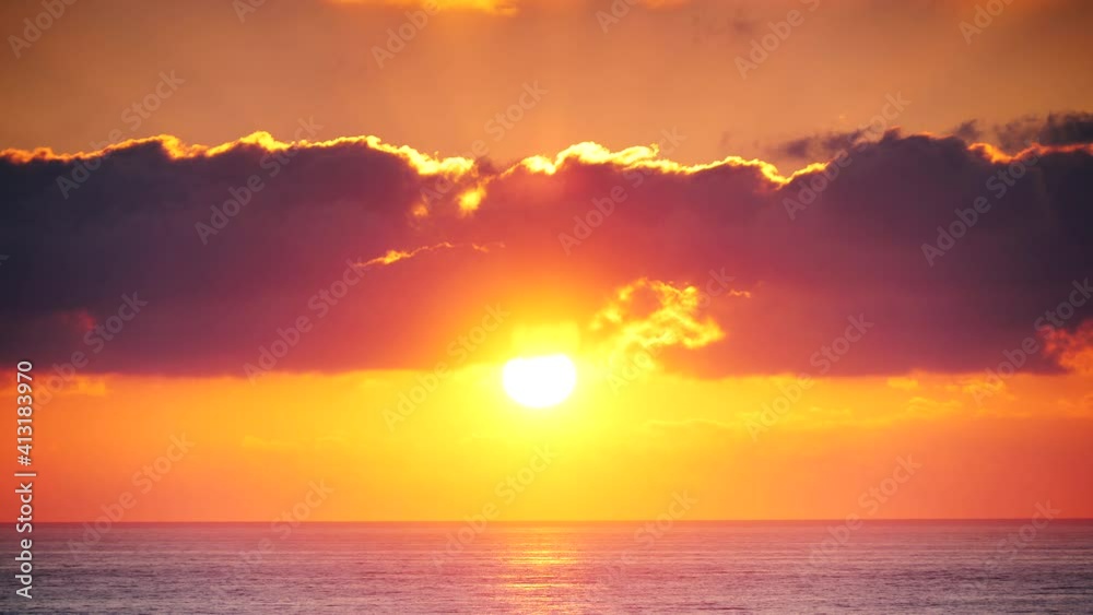 Seascape at early morning, sun rising over sea water. Burning orange sky. Nature landscape in Spain. Seascape at early morning, sun rising over sea water. Burning orange sky. Nature landscape in Spain.