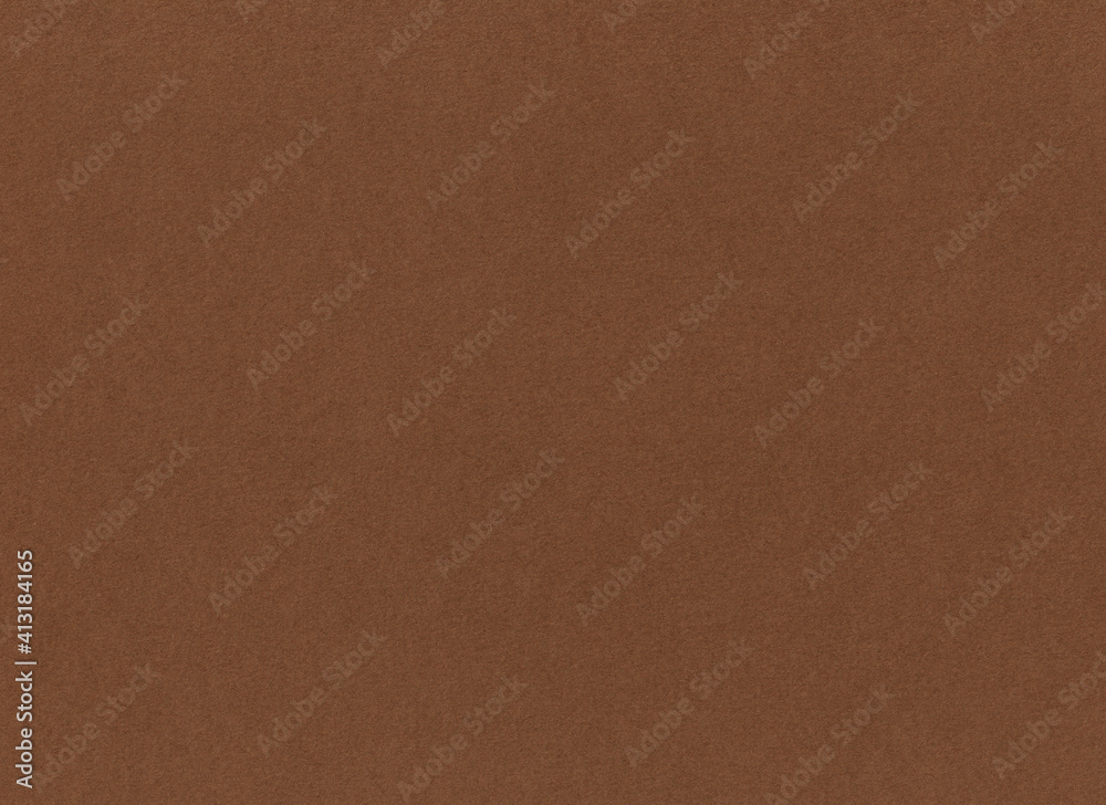 Chocolate paper background. Horizontal photo in walnut brown or hazel color. Textured surface template for eco banner, poster Chocolate paper background. Horizontal photo in walnut brown or hazel color. Textured surface template for eco banner, poster