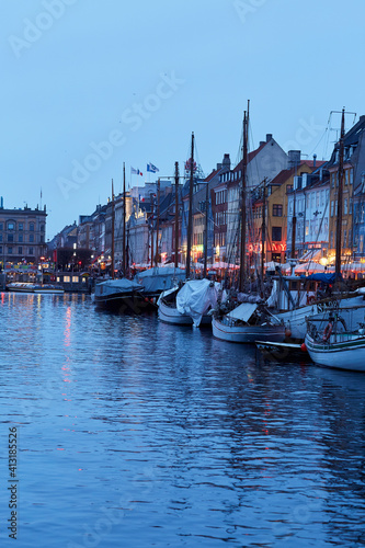 boats in water in copenhagen harbor