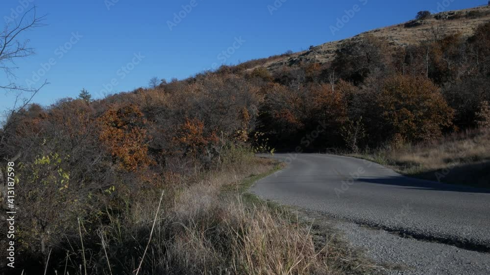 Autumn view of a winding road to Mt Scott, Wichita Mountains in Oklahoma. Autumn view of a winding road to Mt Scott, Wichita Mountains in Oklahoma.