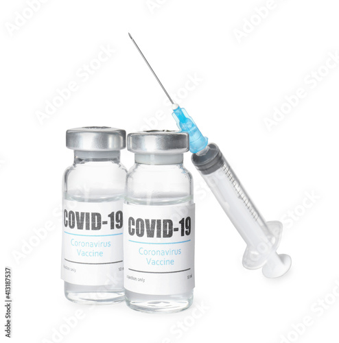 Vials with vaccine against coronavirus and syringe on white background