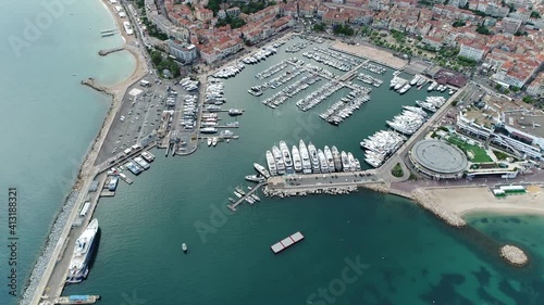 Aerial helicopter view of Vieux Port one of the marinas located next to the Palais des Festivals and Pierre Canto at the far end of the Croisette it is the main haven and used for yacht charters 4k photo