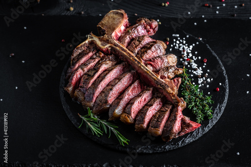 Εκτύπωση καμβά Gourmet grilled and sliced porterhouse steak T-bone with herbs and spices
