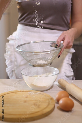Girl sifting flour
