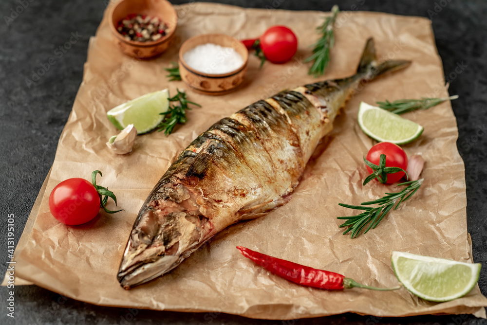 grilled mackerel with lime and spices on stone background grilled mackerel with lime and spices on stone background