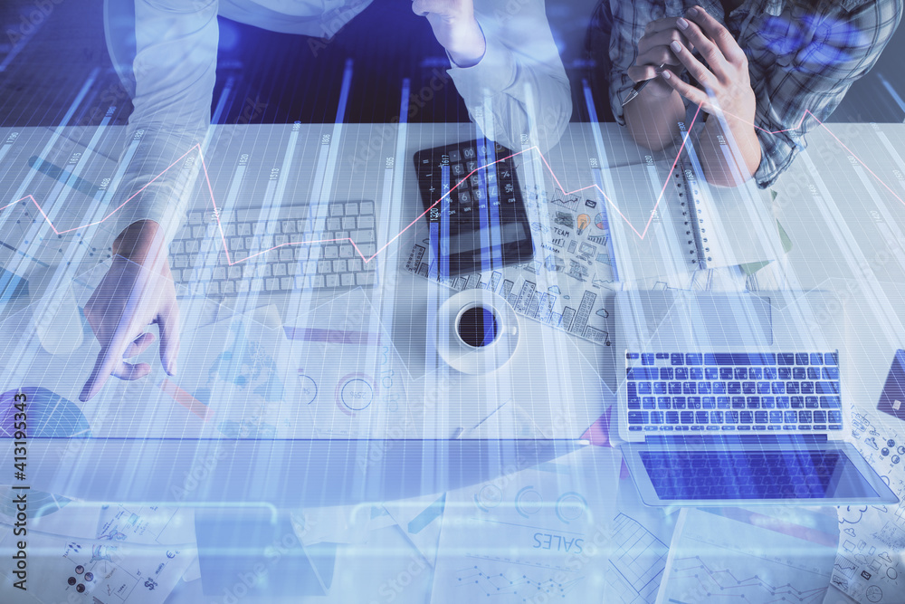 Double exposure of man and woman working together and financial graph hologram drawing. market analysis concept. Computer background. Top View. Double exposure of man and woman working together and financial graph hologram drawing. market analysis concept. Computer background. Top View.