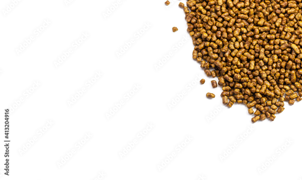 Buckwheat tea on a white background copy space. Isolate. Buckwheat tea close-up macro photography. Scattered buckwheat tea pellets on white background top view. Buckwheat tea on a white background copy space. Isolate. Buckwheat tea close-up macro photography. Scattered buckwheat tea pellets on white background top view.
