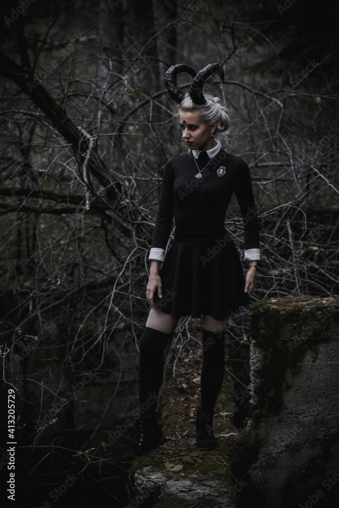 Naklejka premium Witch in the form of a student in the forest