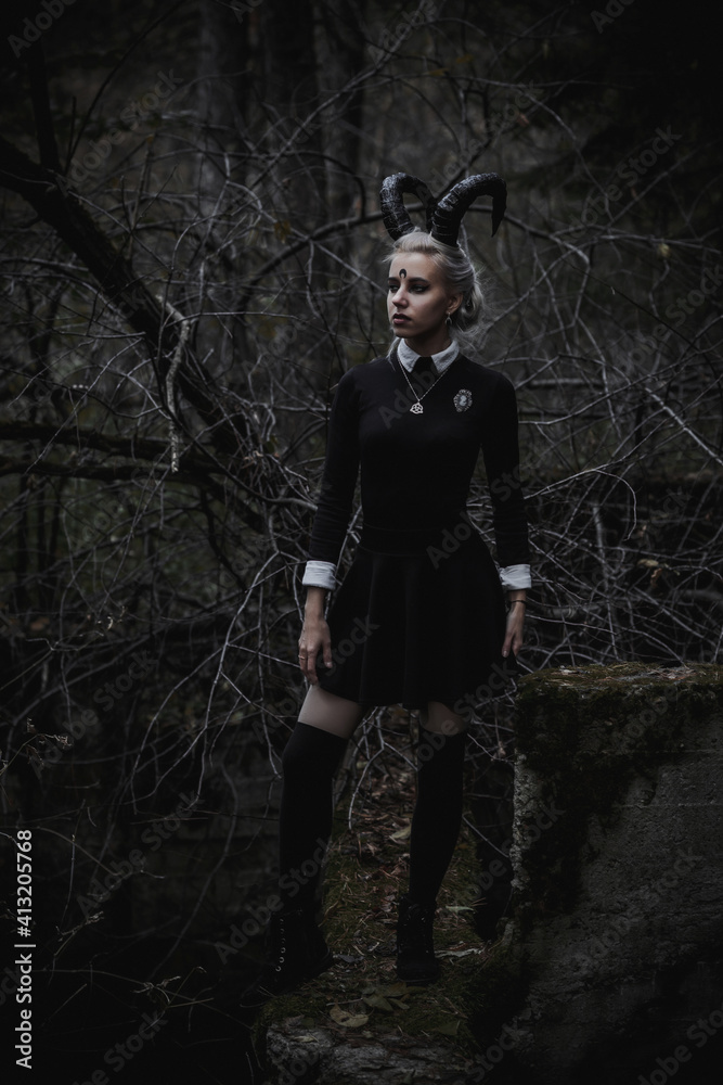 Naklejka premium Witch in the form of a student in the forest