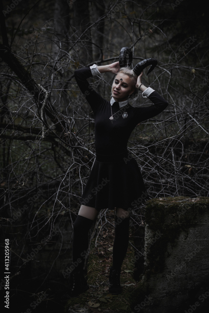 Naklejka premium Witch in the form of a student in the forest