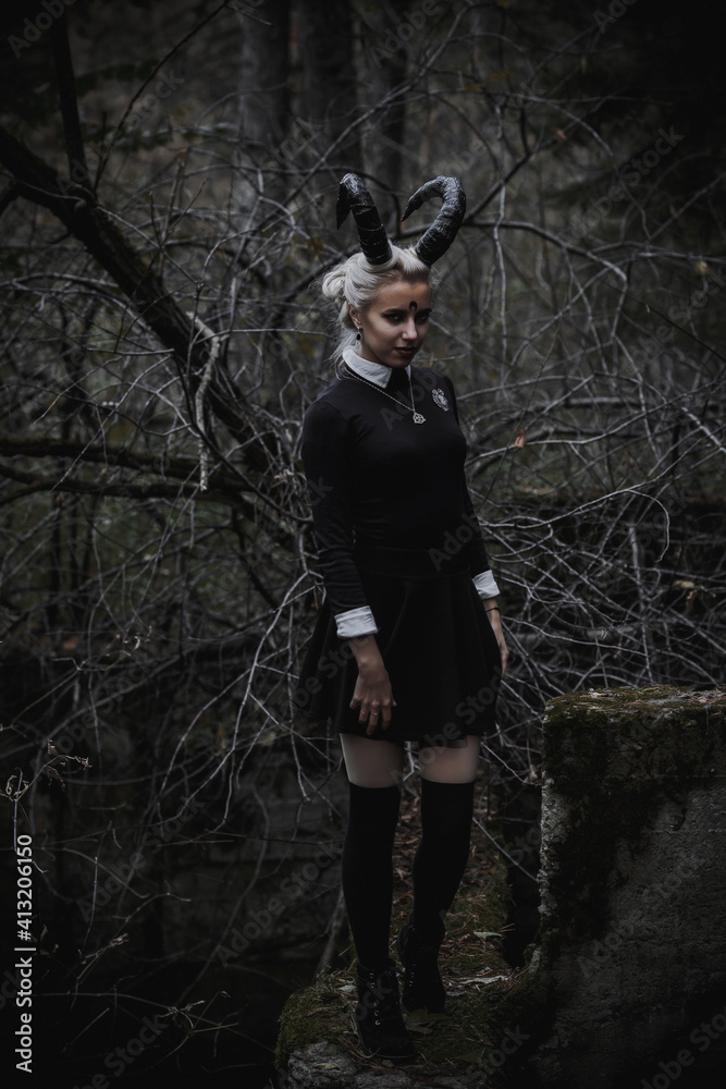 Naklejka premium Witch in the form of a student in the forest