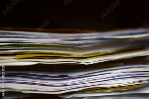 Stack of old papers, books, data sheets.