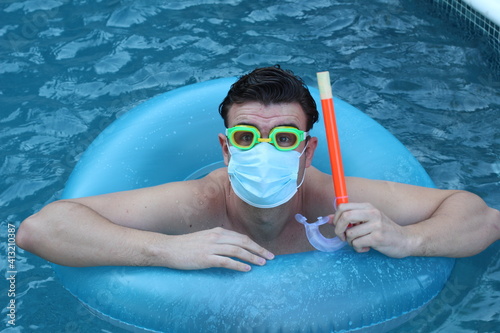 Man snorkeling with surgical mask