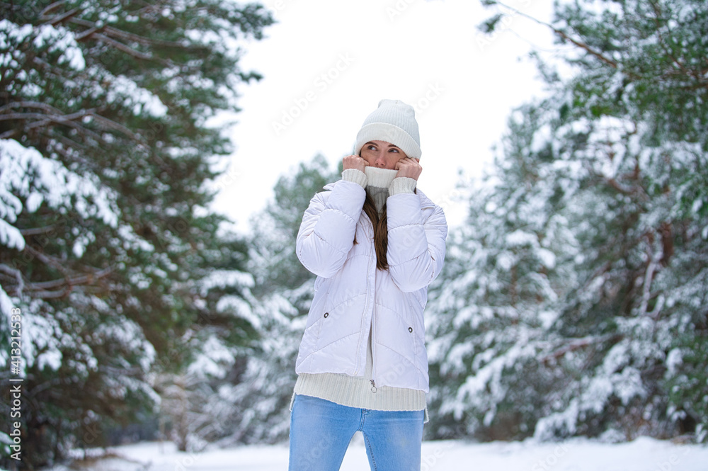 beautiful smiling young woman in wintertime outdoor. Winter concept