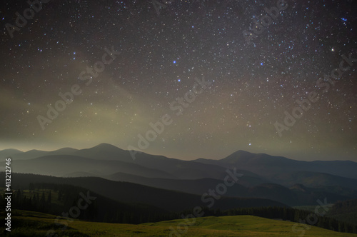 Beautiful starry sky in the Ukrainian mountain village in the Carpathians