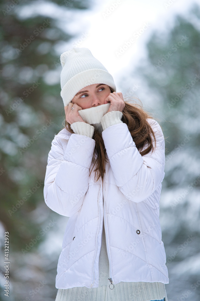 beautiful smiling young woman in wintertime outdoor. Winter concept beautiful smiling young woman in wintertime outdoor. Winter concept