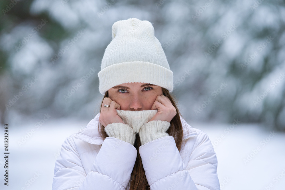 beautiful smiling young woman in wintertime outdoor. Winter concept beautiful smiling young woman in wintertime outdoor. Winter concept