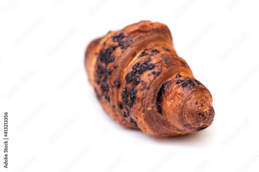 From above of delicious fresh crusty croissant and pieces of dark chocolate composed on a isolated background. From above of delicious fresh crusty croissant and pieces of dark chocolate composed on a isolated background.