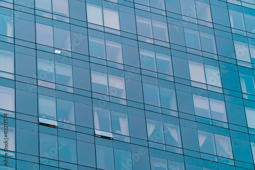 Blue glass windows of modern skyscraper. Office rent  leasing concept