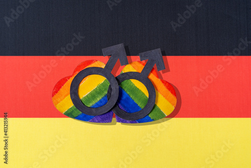 The flag of Germany and the heart in the form of the LGBT flag. photo