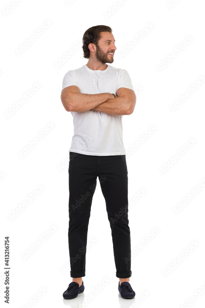 Handsome Man Is Standing With Arms Crossed And Looking Away. Front View. Handsome Man Is Standing With Arms Crossed And Looking Away. Front View.