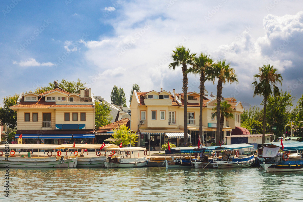 Touristic River Boats moored at the pier of the Dalyan River, Mugla, Turkey. Touristic River Boats moored at the pier of the Dalyan River, Mugla, Turkey.