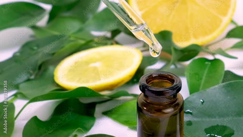 lemon essential oil in small bottles. selective focus. lemon essential oil in small bottles. selective focus.