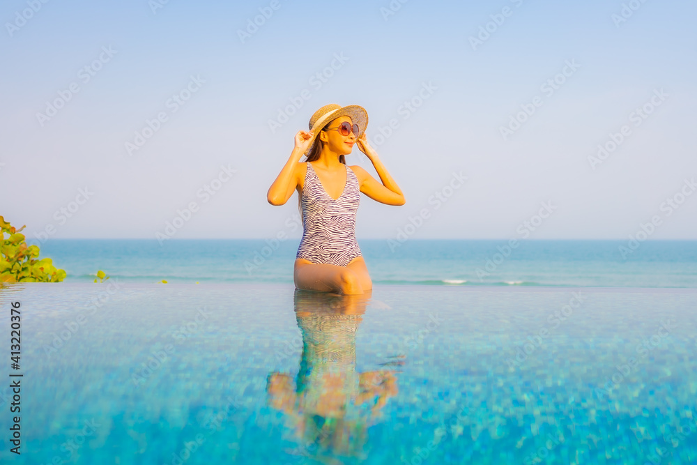 Portrait beautiful young asian woman relax smile enjoy leisure around swimming pool Portrait beautiful young asian woman relax smile enjoy leisure around swimming pool
