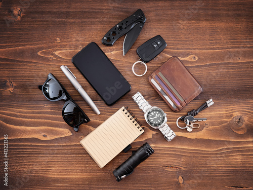 Tablou canvas Flat lay of EDC or Every Day Carry items and tools on wooden background
